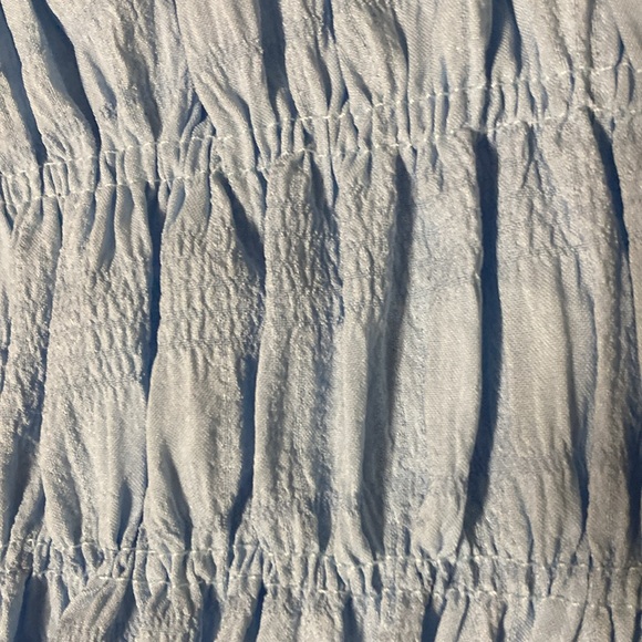 Light blue stretchy shorts with a small cute black bow. - Picture 4 of 5